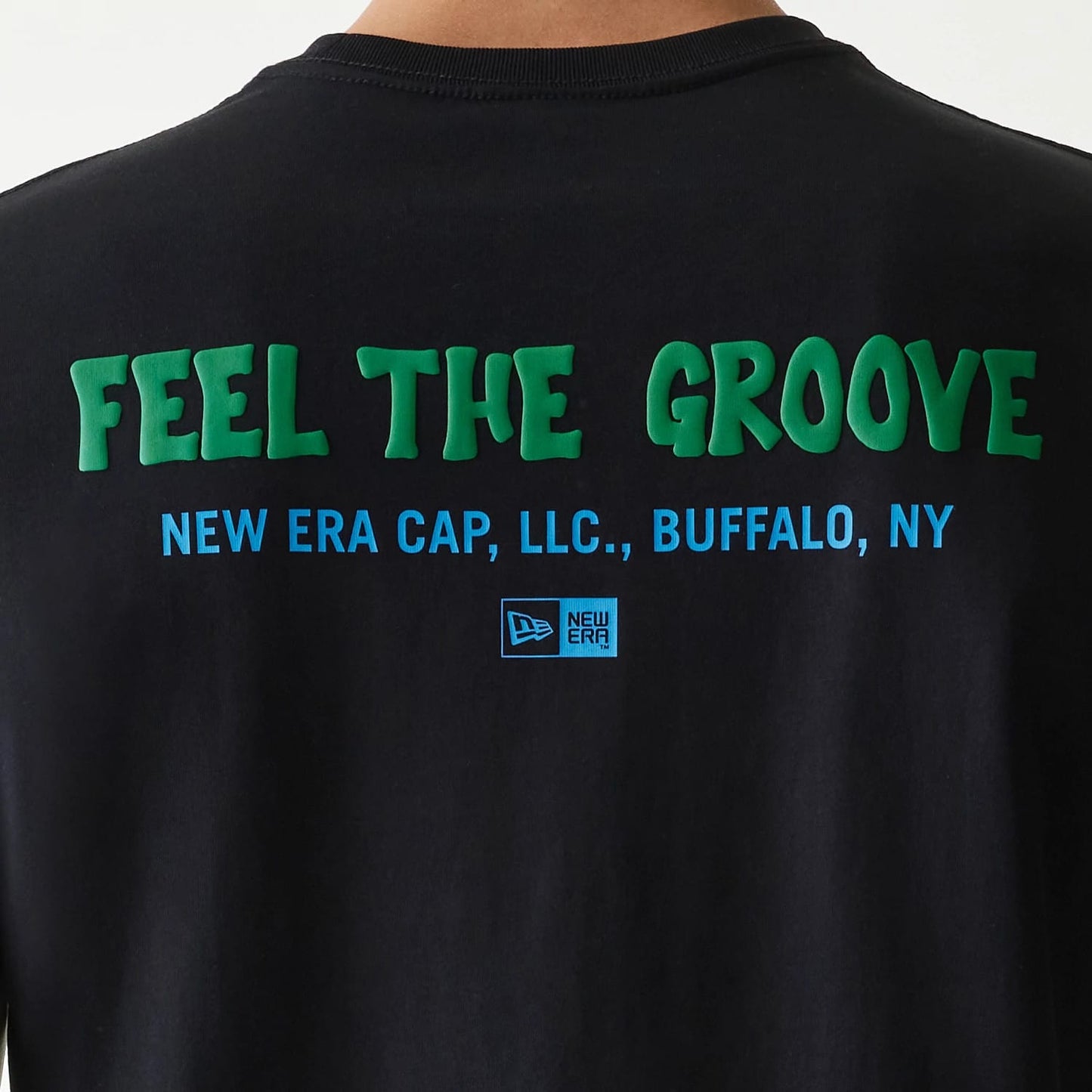 The Male model is wearing New Era Outdoor Earth Day Black Side Pocket T-Shirt 6