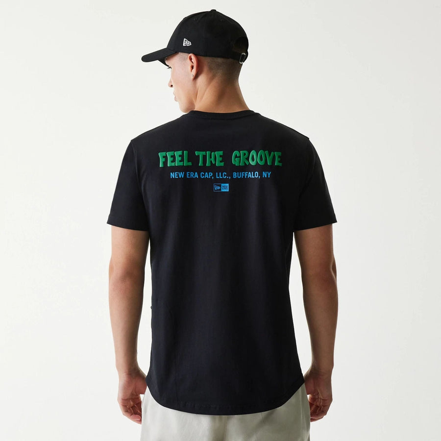 The Male model is wearing New Era Outdoor Earth Day Black Side Pocket T-Shirt 2