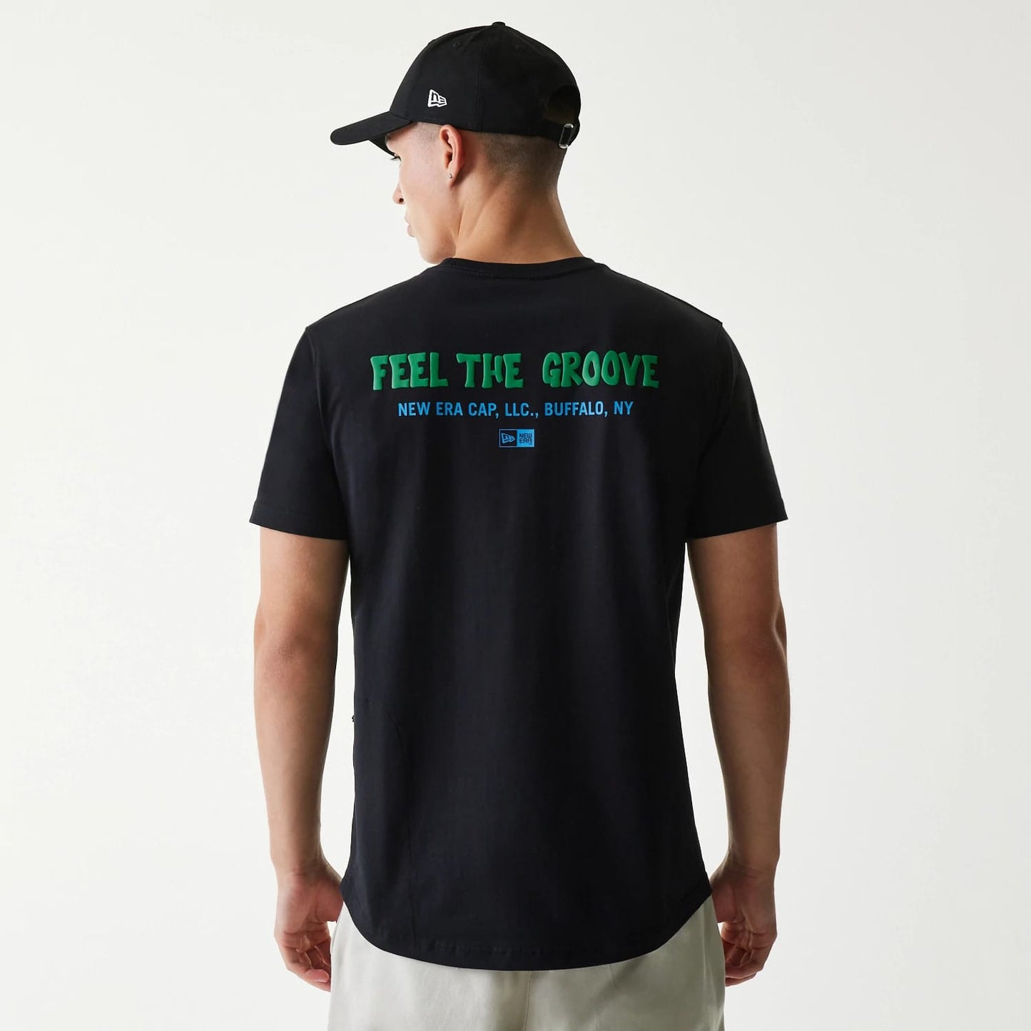 The Male model is wearing New Era Outdoor Earth Day Black Side Pocket T-Shirt 2