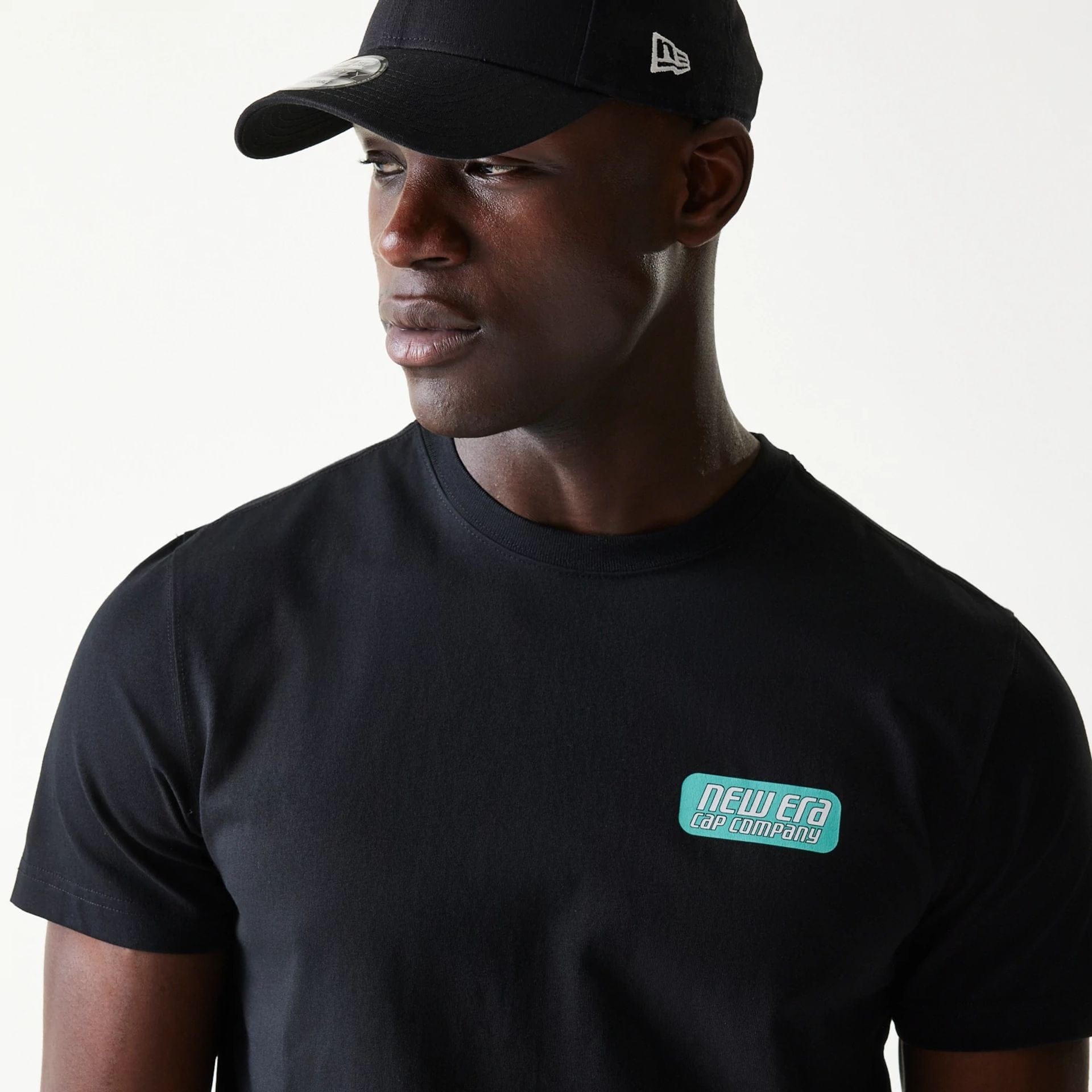The Male model is wearing New Era Classic Black T-Shirt 5