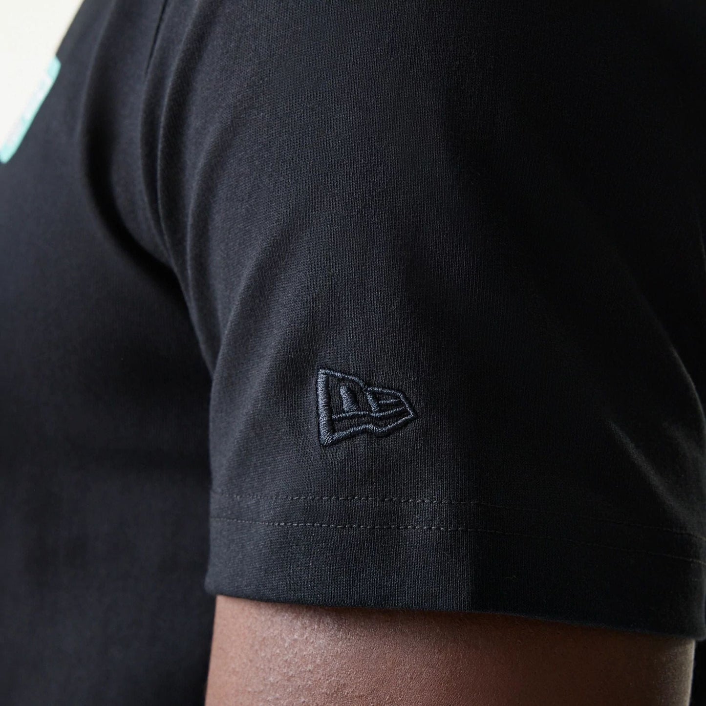 The Male model is wearing New Era Classic Black T-Shirt 7