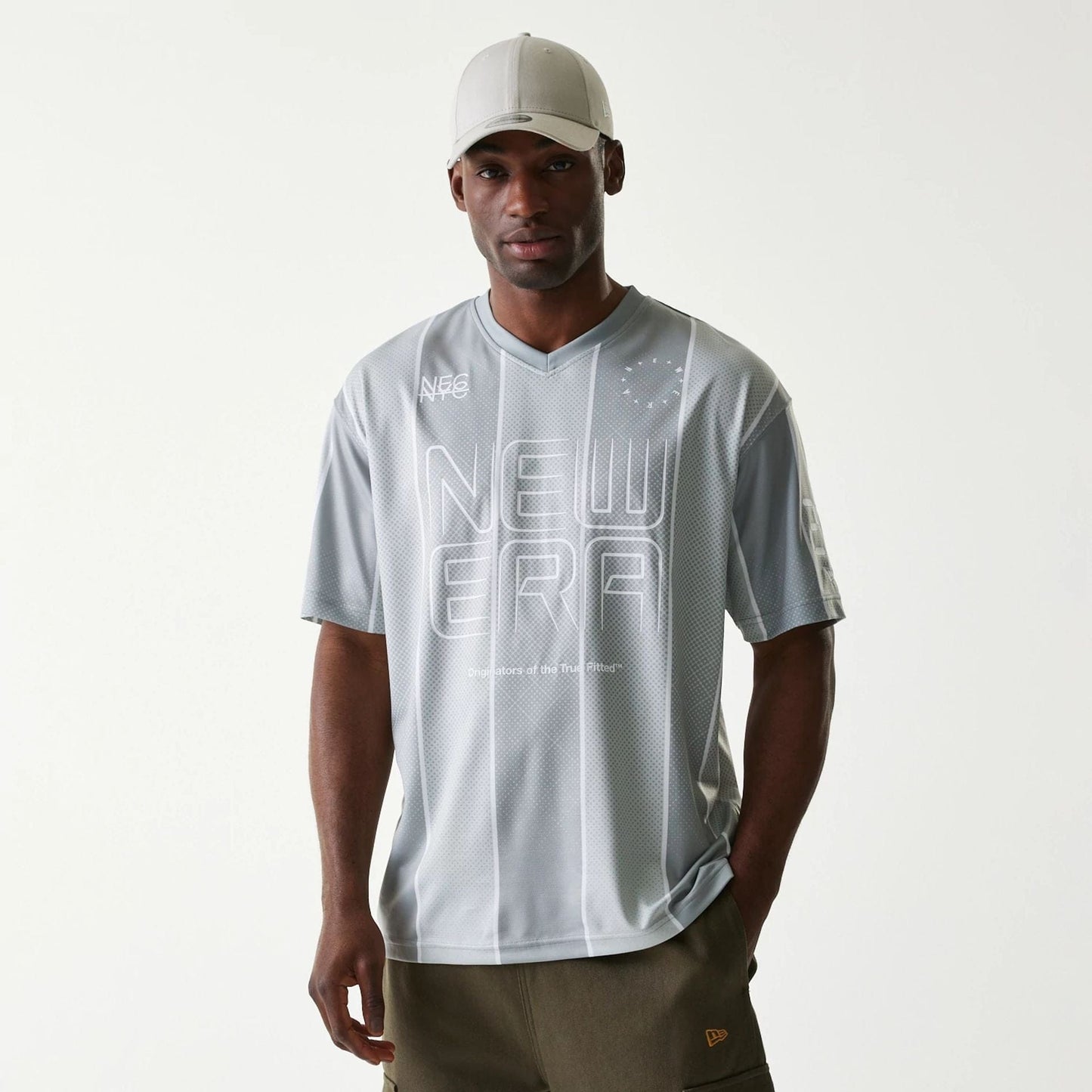 The Male model is wearing New Era City Sport Grey T-Shirt 1
