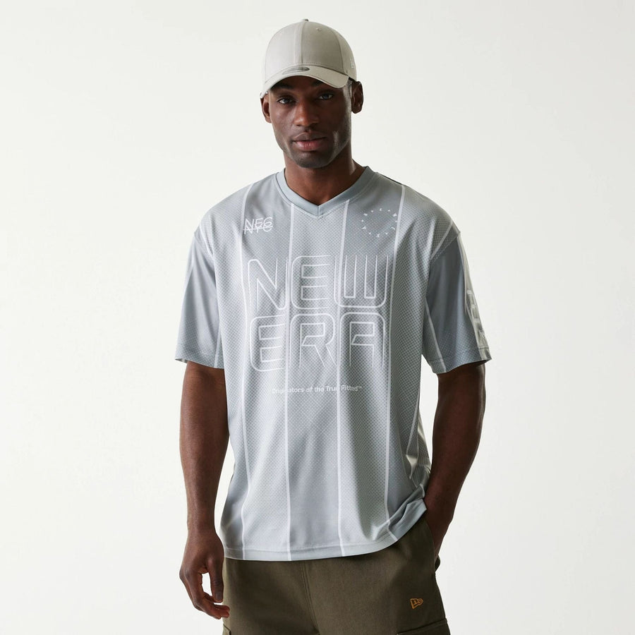The Male model is wearing New Era City Sport Grey T-Shirt 1
