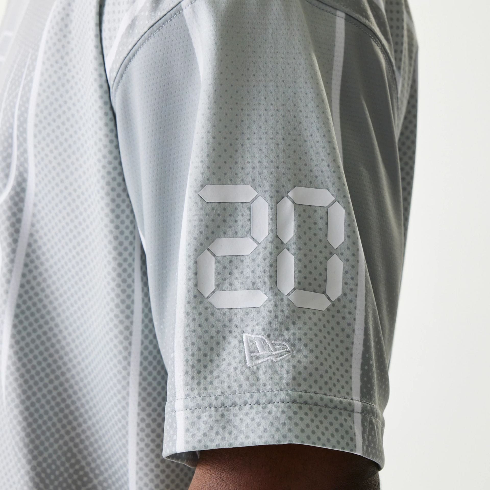 The Male model is wearing New Era City Sport Grey T-Shirt 5