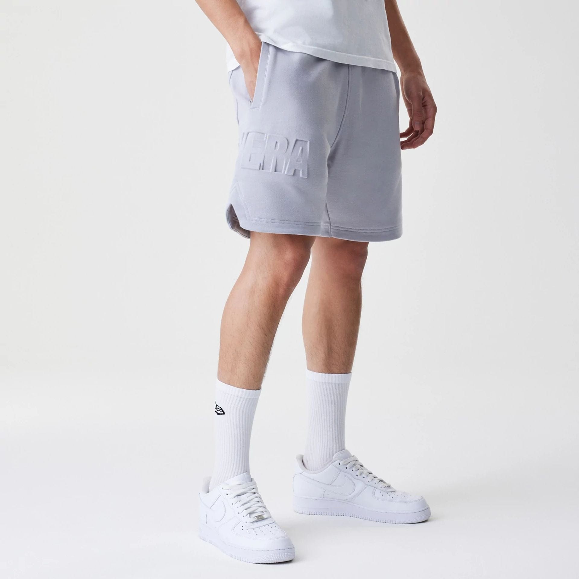 The Male model is wearing New Era Tonal Pack Grey Shorts 5