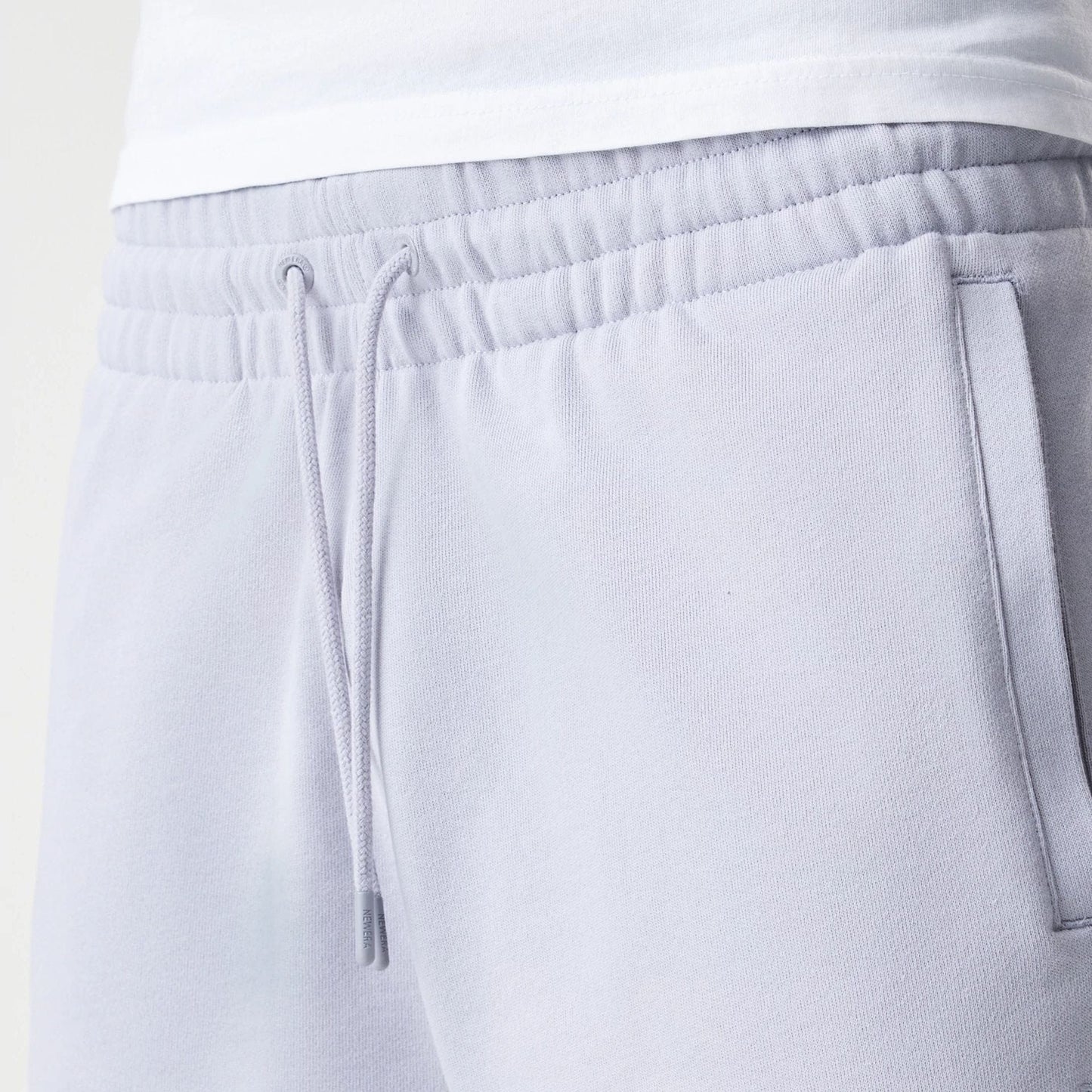 The Male model is wearing New Era Tonal Pack Grey Shorts 6