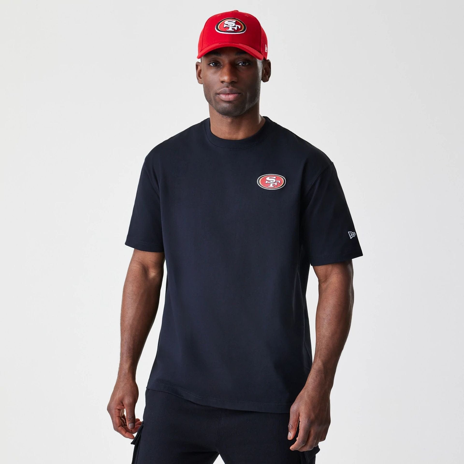 The Male model is wearing San Francisco 49ers NFL Black Oversized T-Shirt 1