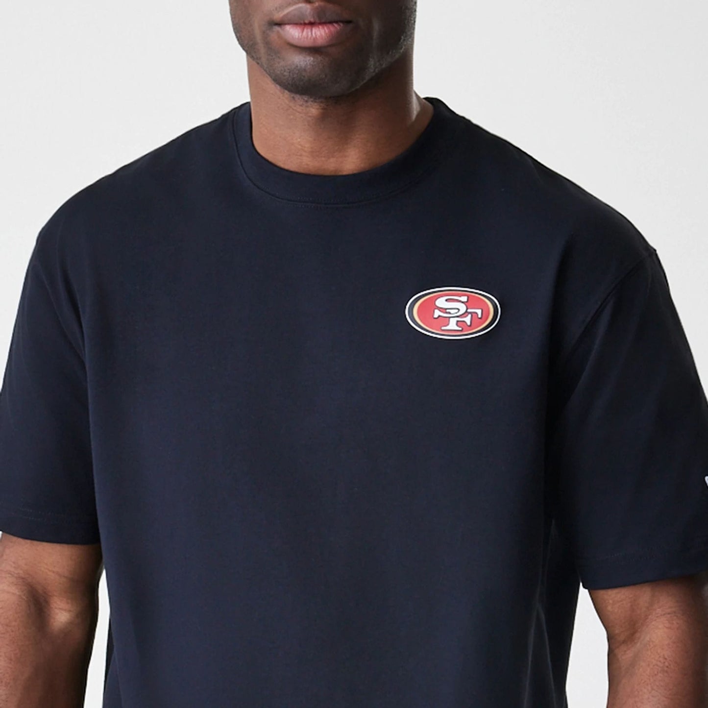 The Male model is wearing San Francisco 49ers NFL Black Oversized T-Shirt 5