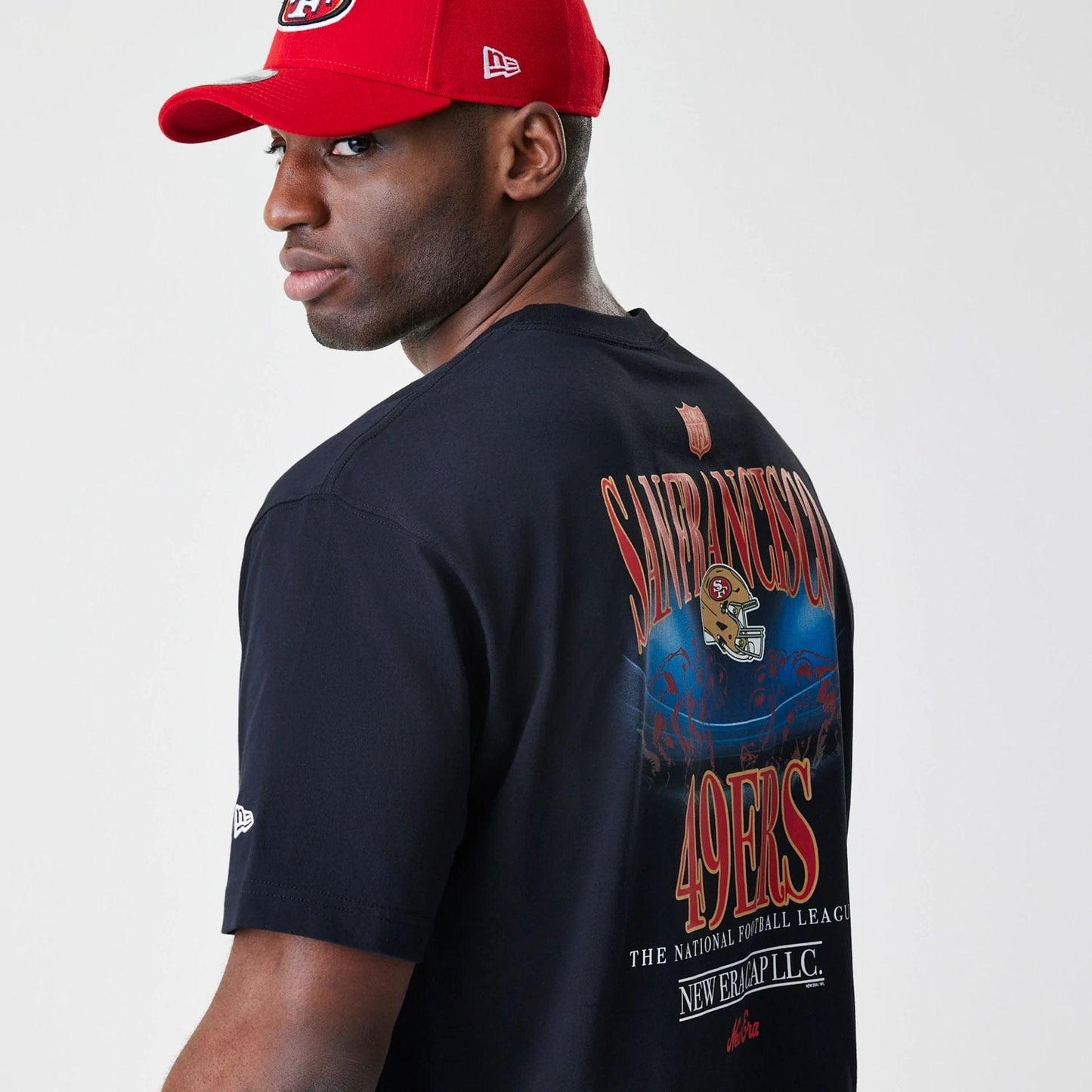 The Male model is wearing San Francisco 49ers NFL Black Oversized T-Shirt 6