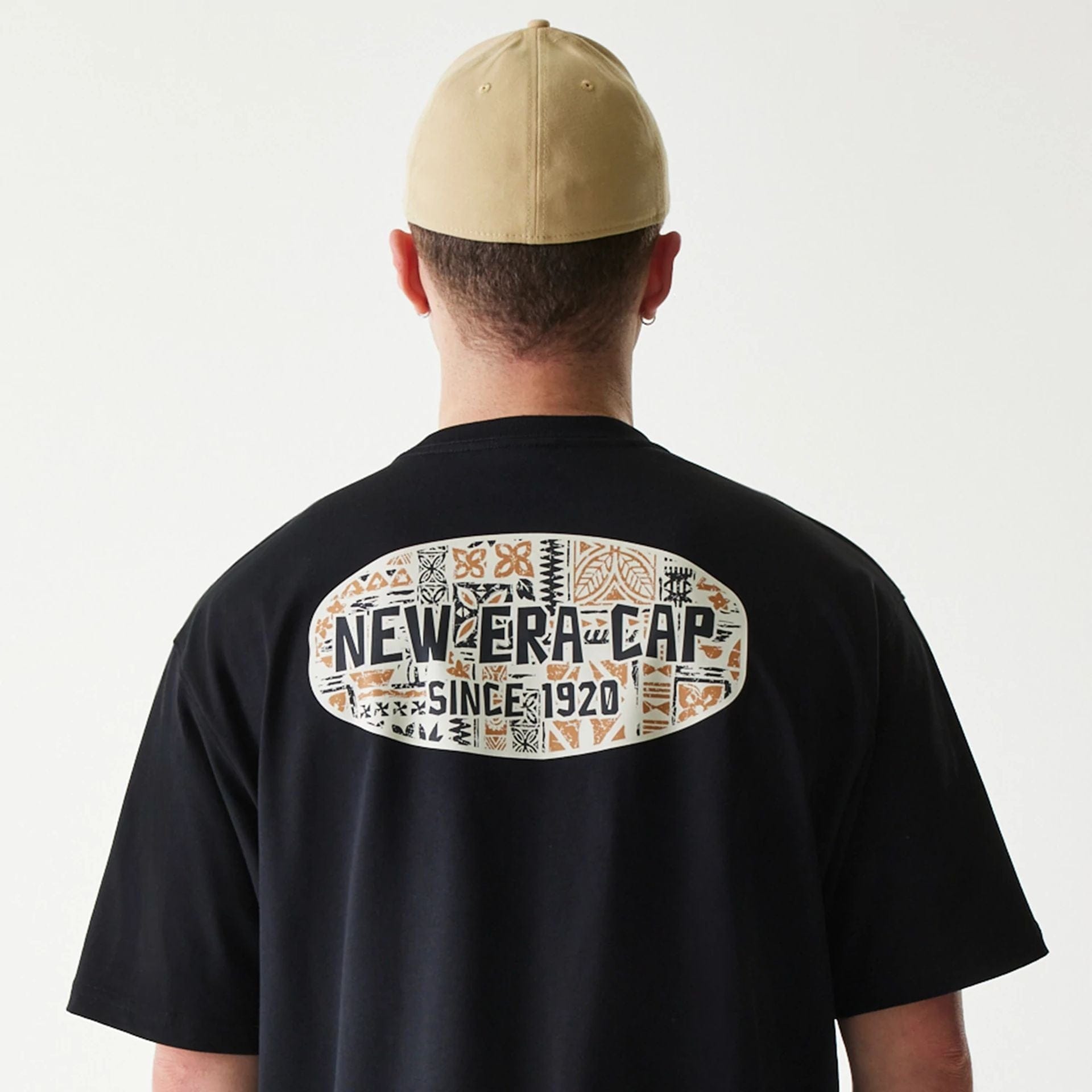 The Male model is wearing New Era Marine Life Club Black Oversized T-Shirt 6