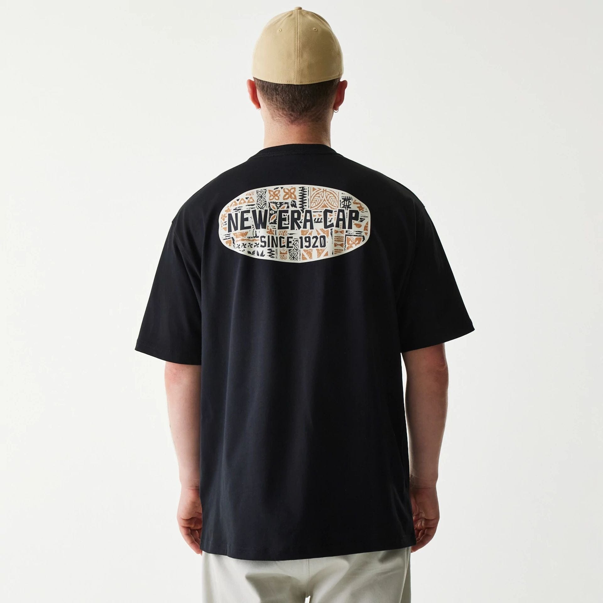 The Male model is wearing New Era Marine Life Club Black Oversized T-Shirt 2