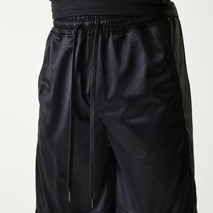 The Male model is wearing New Era Retro Sports Black Mesh Shorts 3