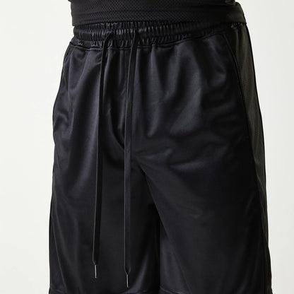The Male model is wearing New Era Retro Sports Black Mesh Shorts 3