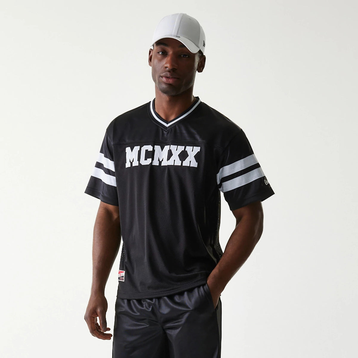 The Male model is wearing New Era Retro Sports Black Mesh Jersey 7