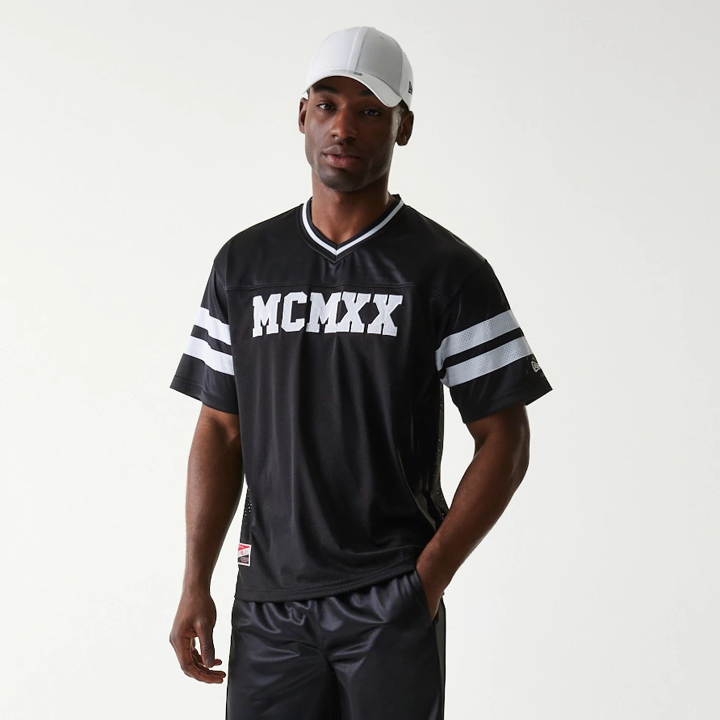 The Male model is wearing New Era Retro Sports Black Mesh Jersey 7