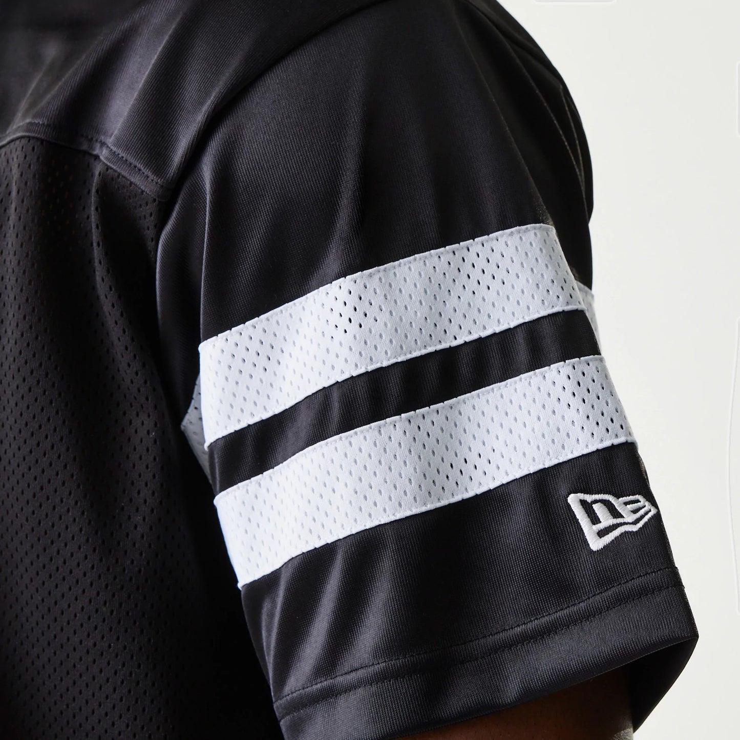 The Male model is wearing New Era Retro Sports Black Mesh Jersey 6