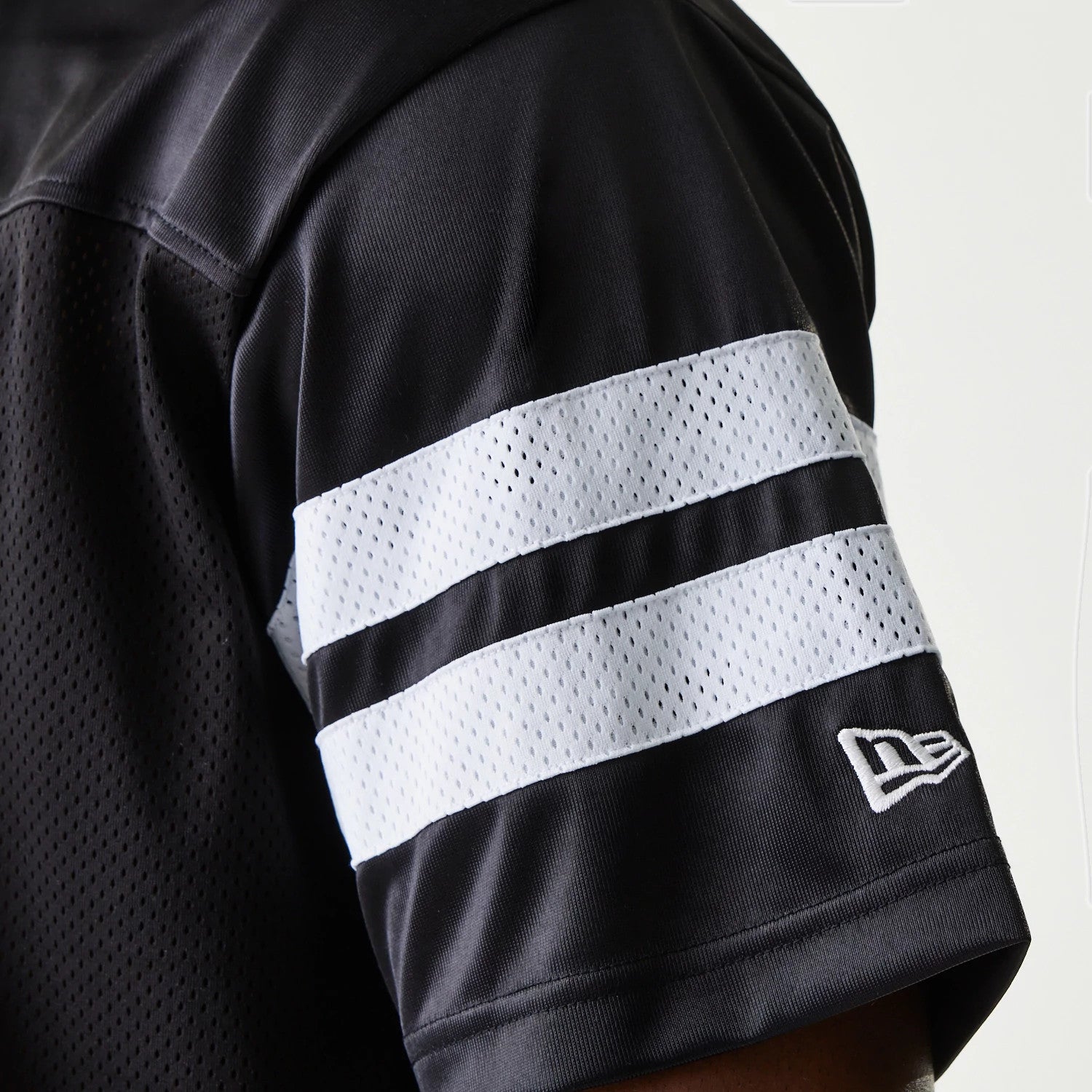 The Male model is wearing New Era Retro Sports Black Mesh Jersey 6