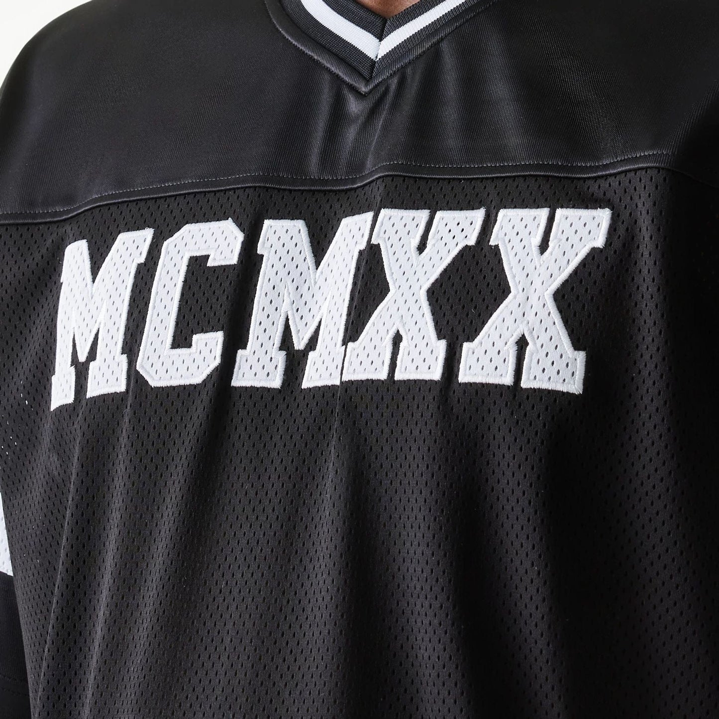 The Male model is wearing New Era Retro Sports Black Mesh Jersey 5