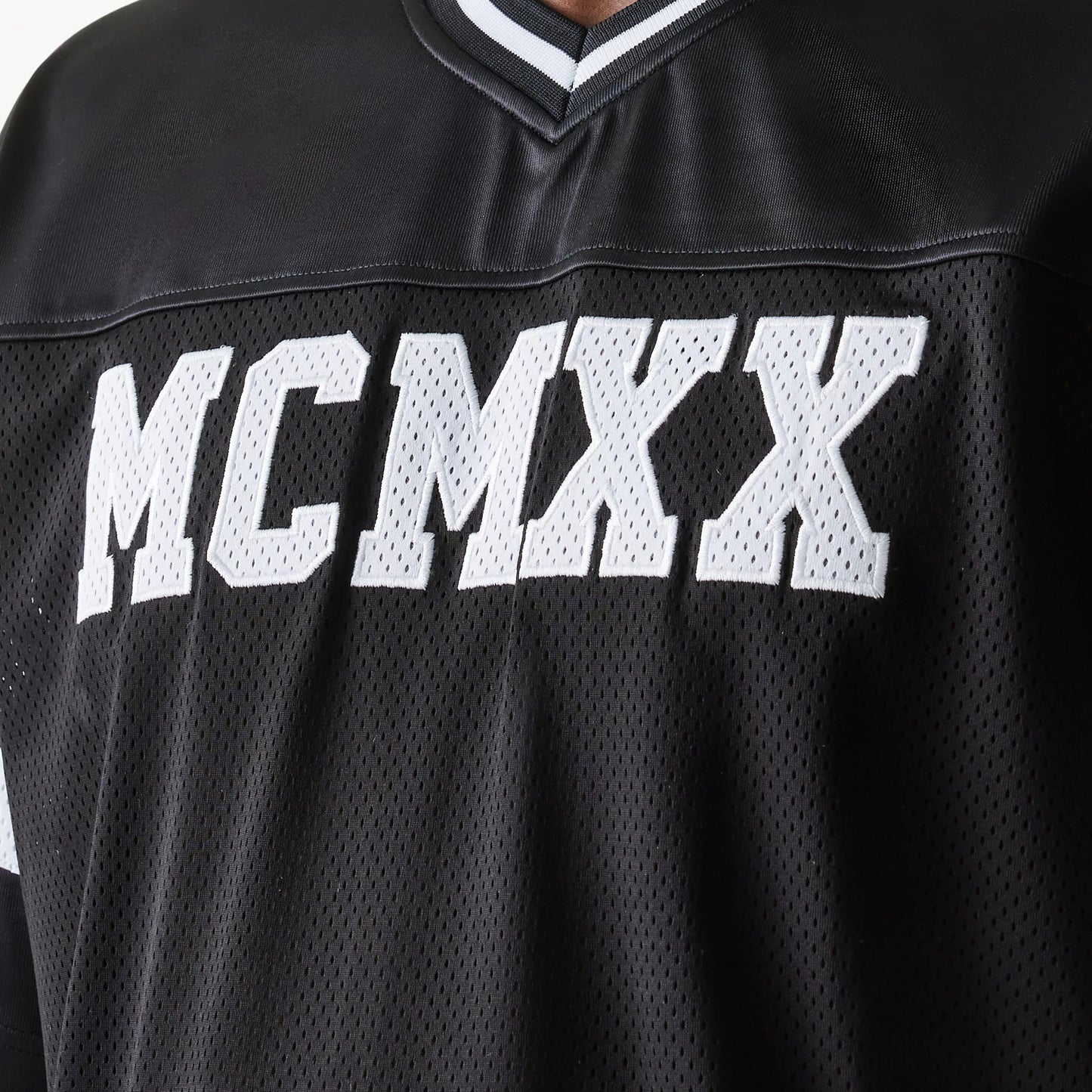 The Male model is wearing New Era Retro Sports Black Mesh Jersey 5