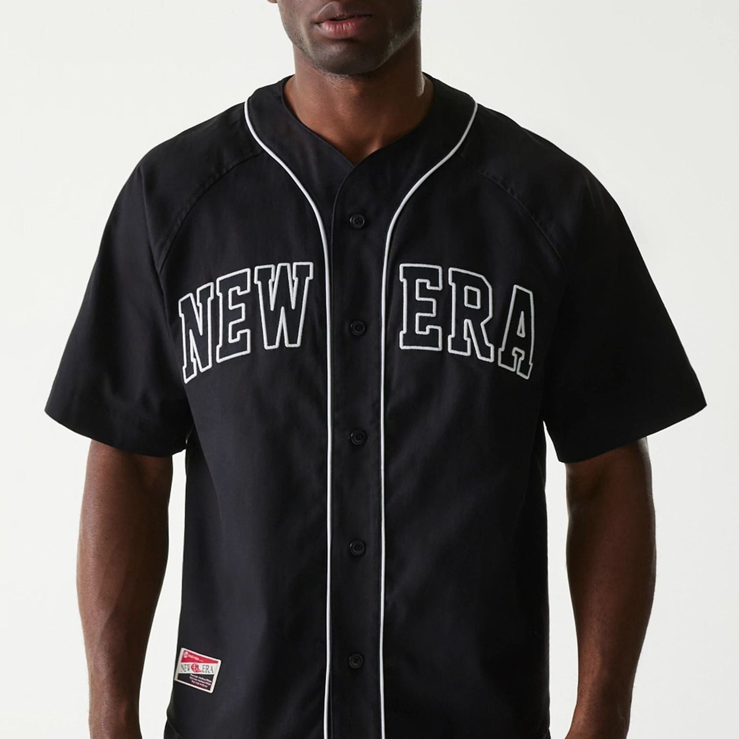 The Male model is wearing New Era Retro Baseball Black Short Sleeve Shirt 3