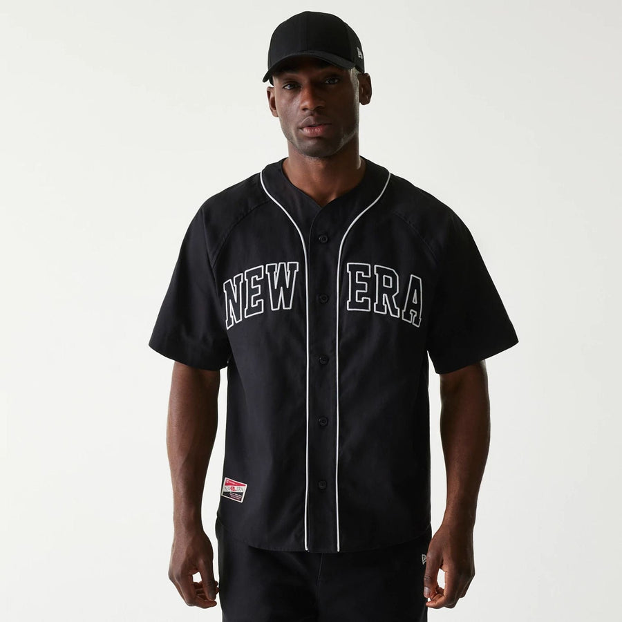 The Male model is wearing New Era Retro Baseball Black Short Sleeve Shirt 1