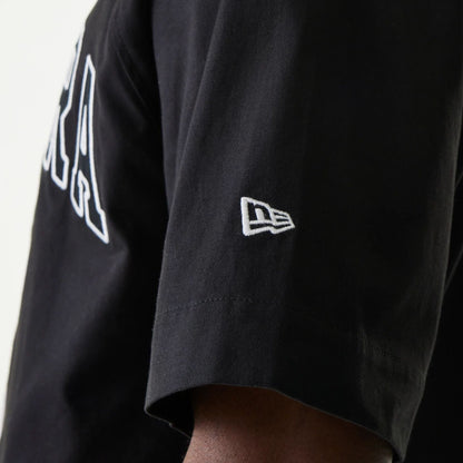 The Male model is wearing New Era Retro Baseball Black Short Sleeve Shirt 6