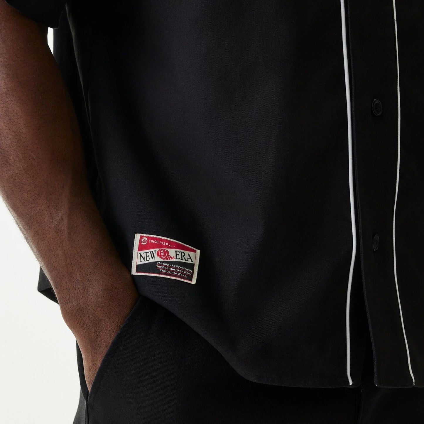 The Male model is wearing New Era Retro Baseball Black Short Sleeve Shirt 5