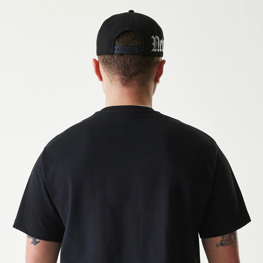The Male model is wearing New Era Peace Symbol Black T-Shirt 7