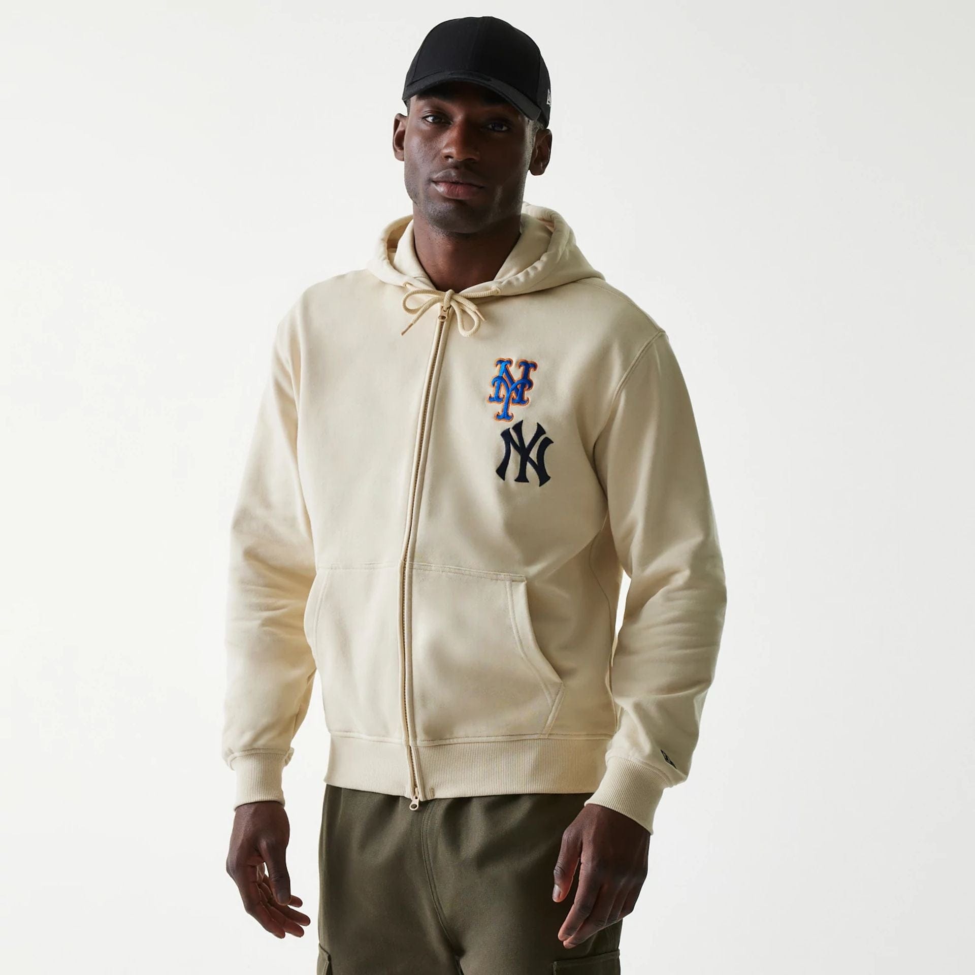 The Male model is wearing MLB Subway Series Beige Zip Front Hoodie 1