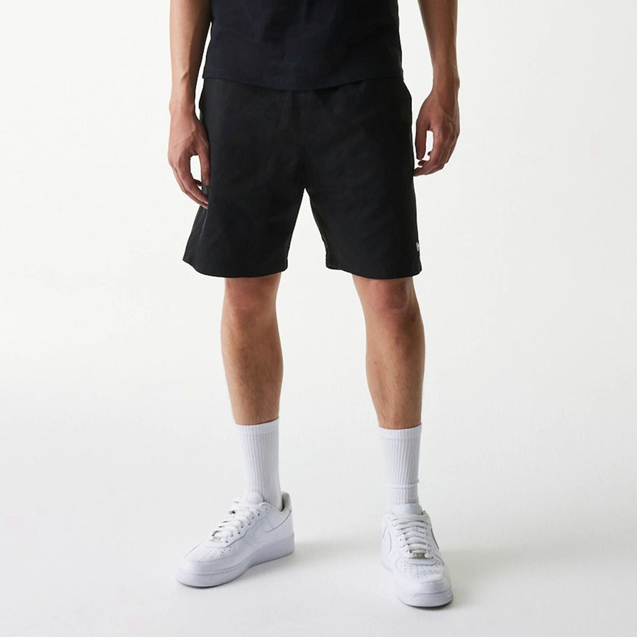 The Male model is wearing New Era Japan Woven Black Shorts 8