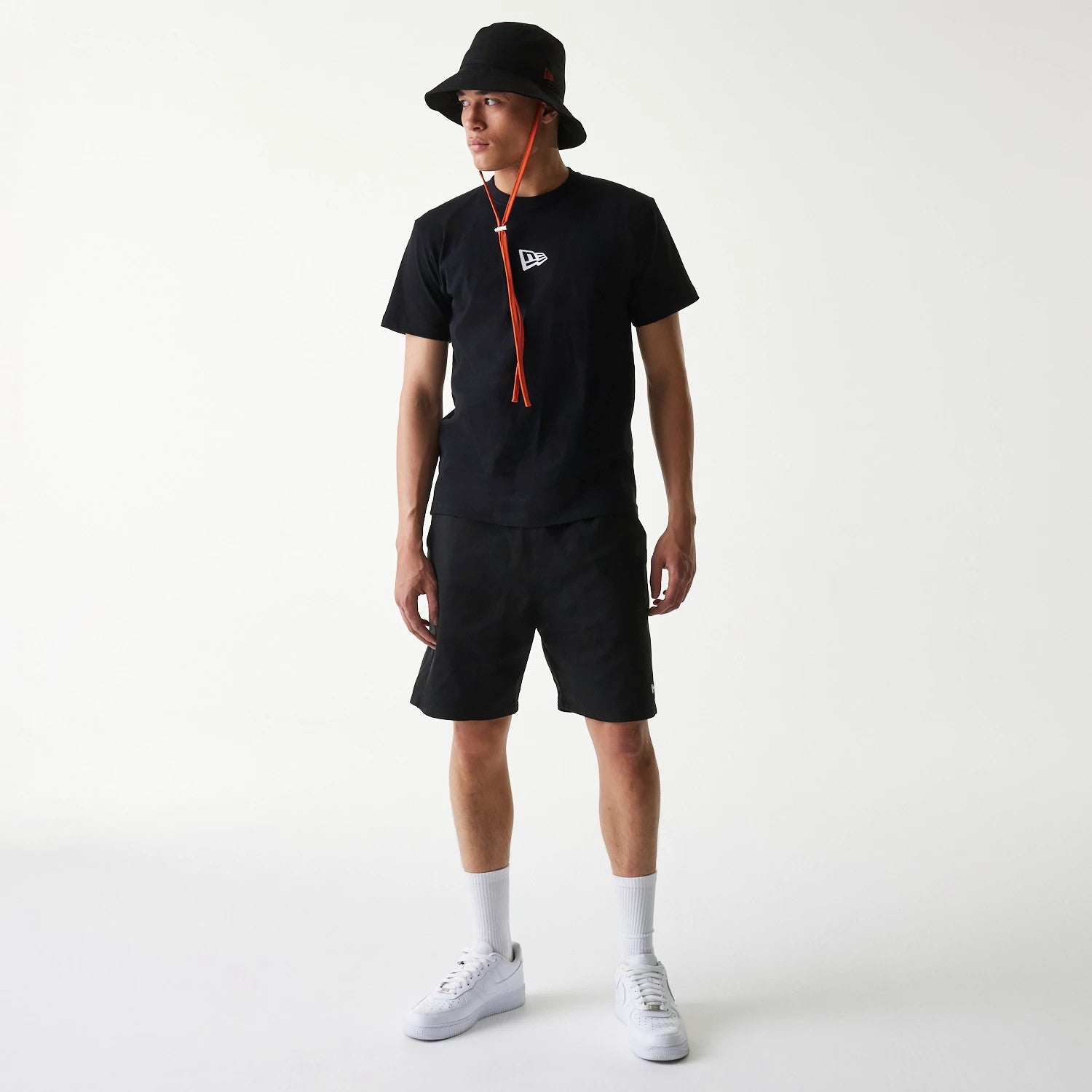 The Male model is wearing New Era Japan Woven Black Shorts 7
