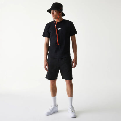 The Male model is wearing New Era Japan Woven Black Shorts 7