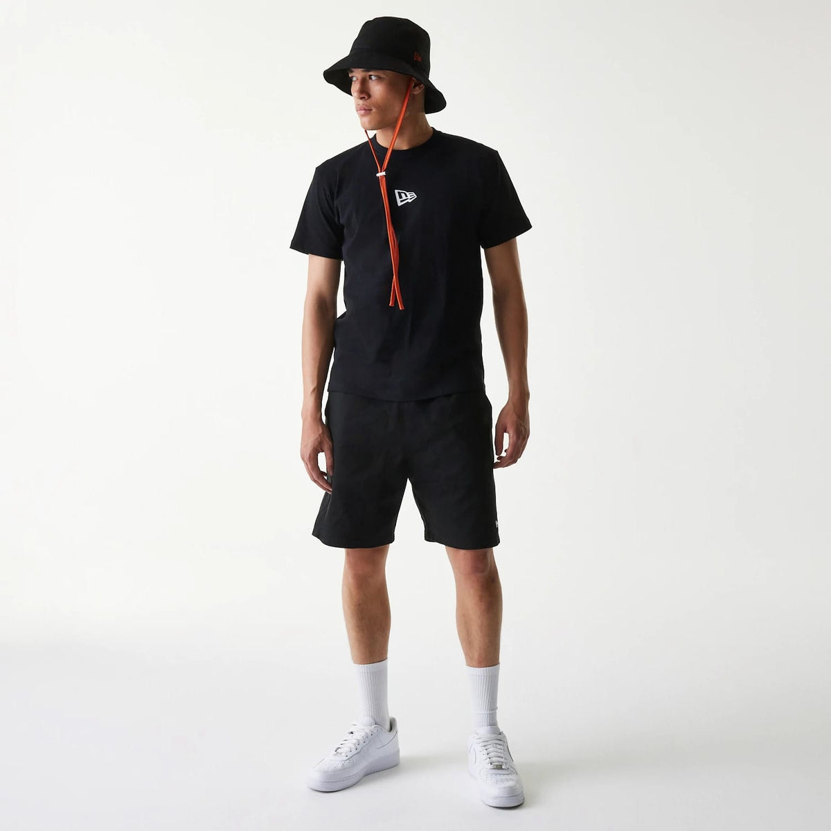 The Male model is wearing New Era Japan Woven Black Shorts 7