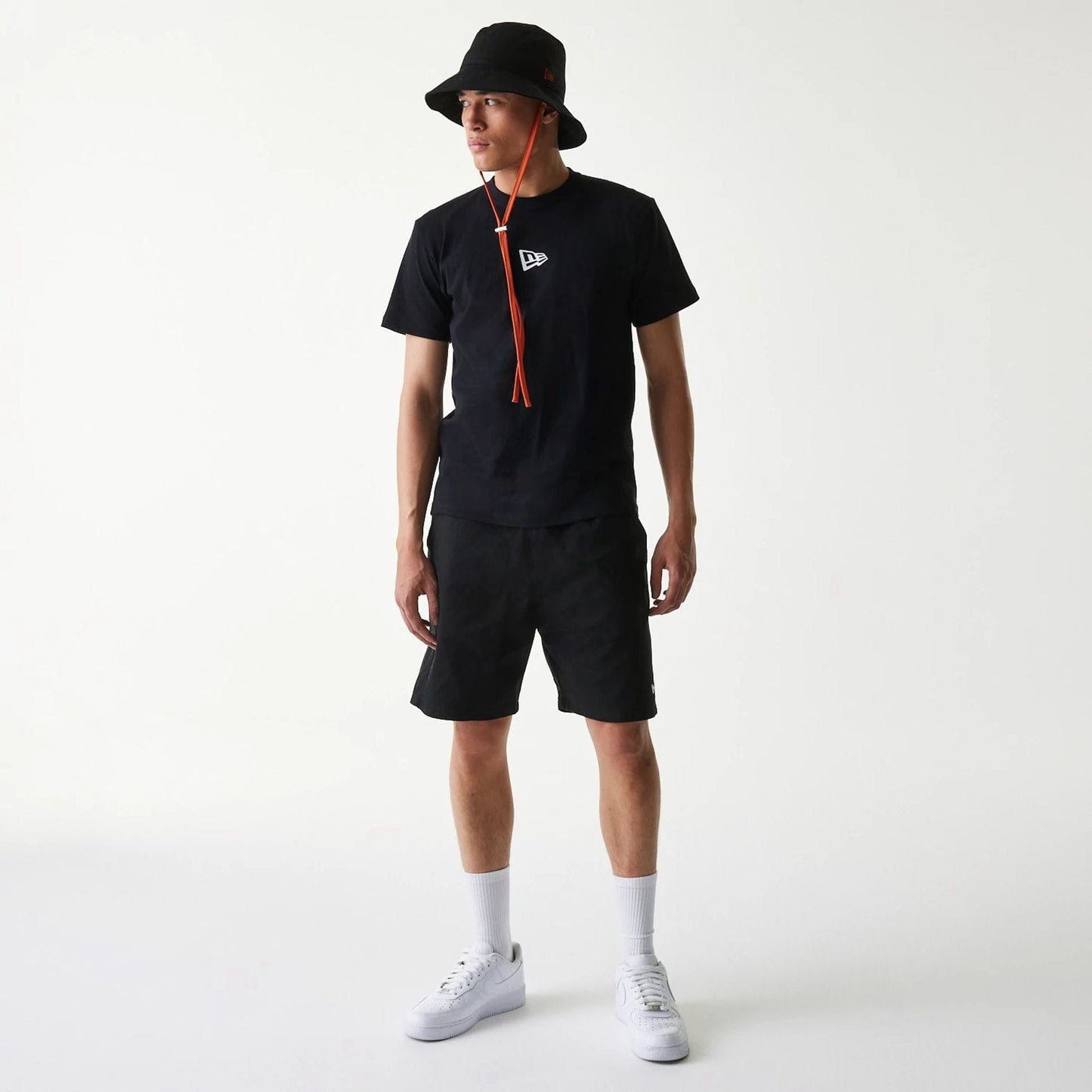 The Male model is wearing New Era Japan Woven Black Shorts 7