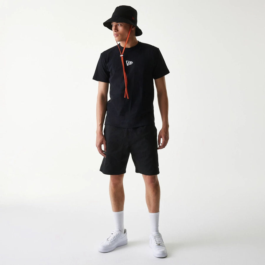 The Male model is wearing New Era Japan Woven Black Shorts 7