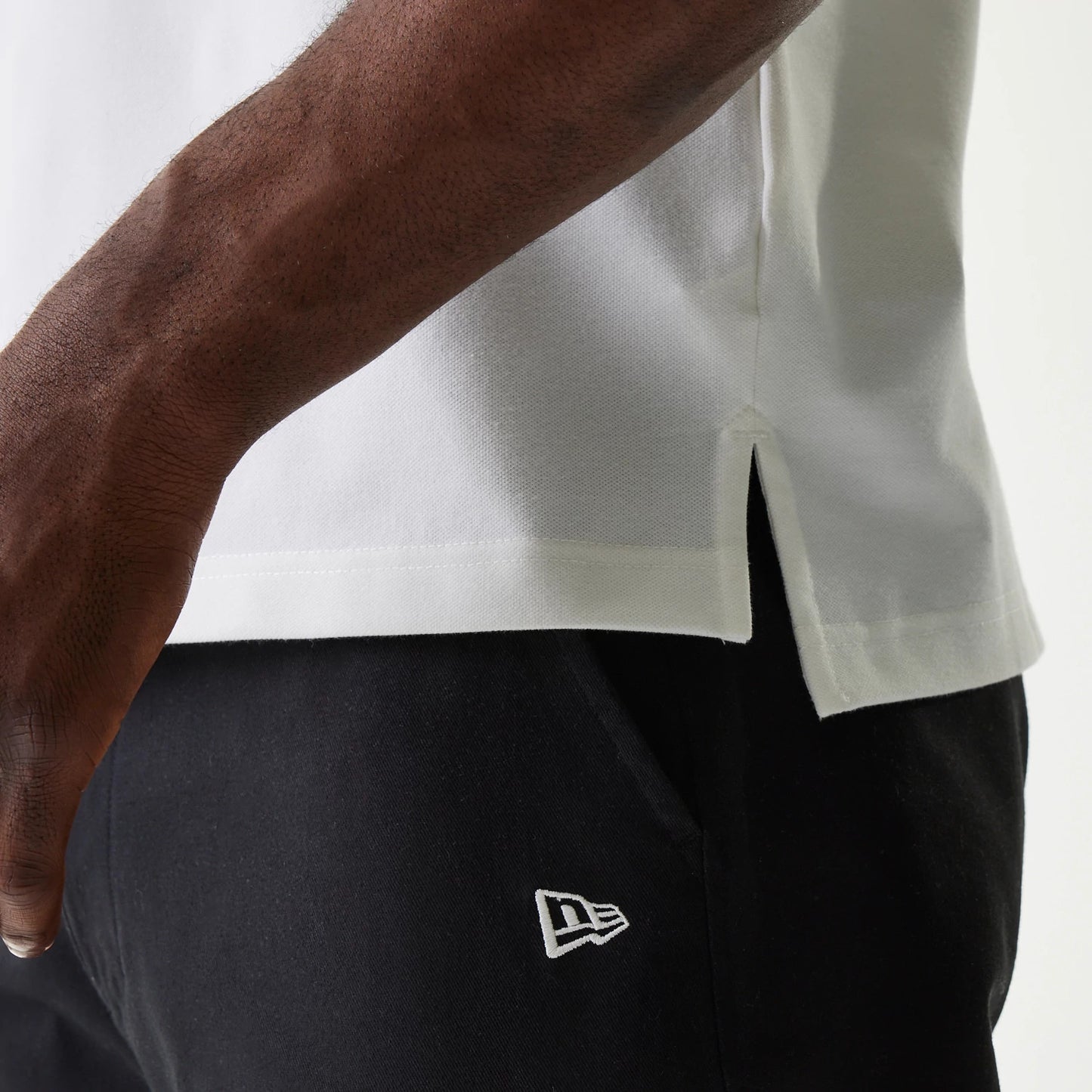 The Male model is wearing New Era Japan Collar Logo White Polo T-Shirt 5