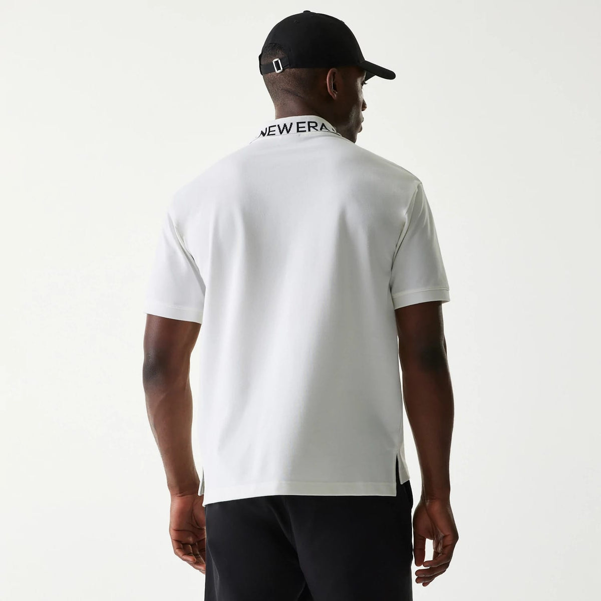 The Male model is wearing New Era Japan Collar Logo White Polo T-Shirt 2