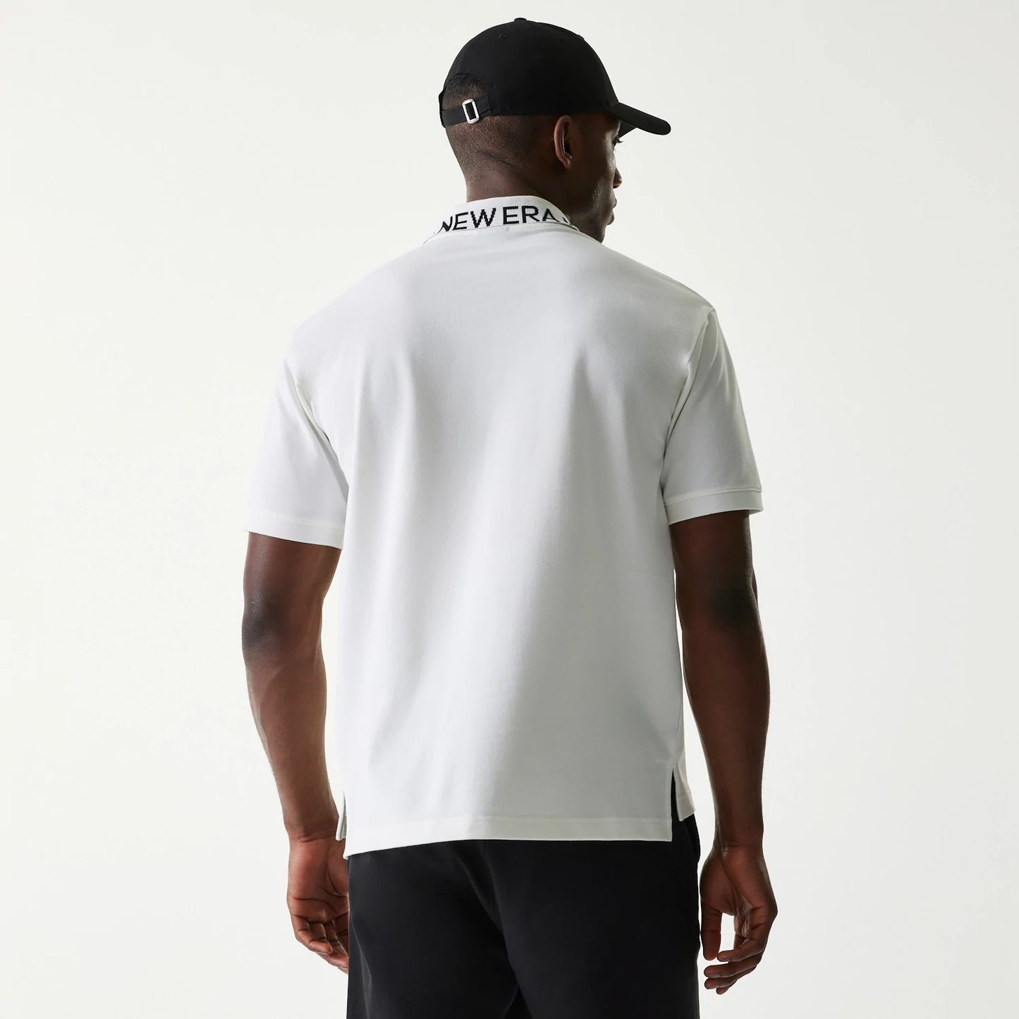 The Male model is wearing New Era Japan Collar Logo White Polo T-Shirt 2