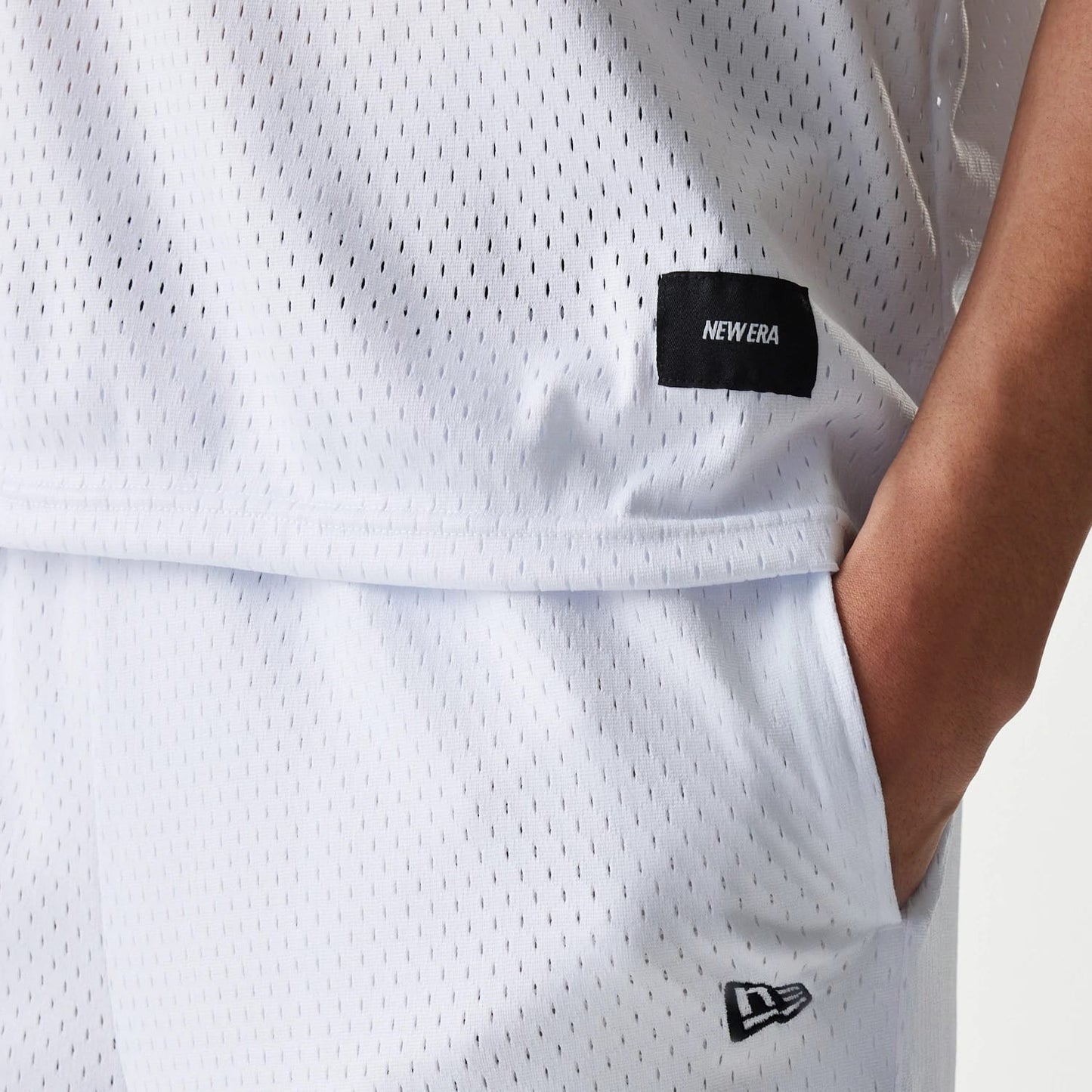 The Male model is wearing New Era Japan Mesh White Sleeveless T-Shirt 4