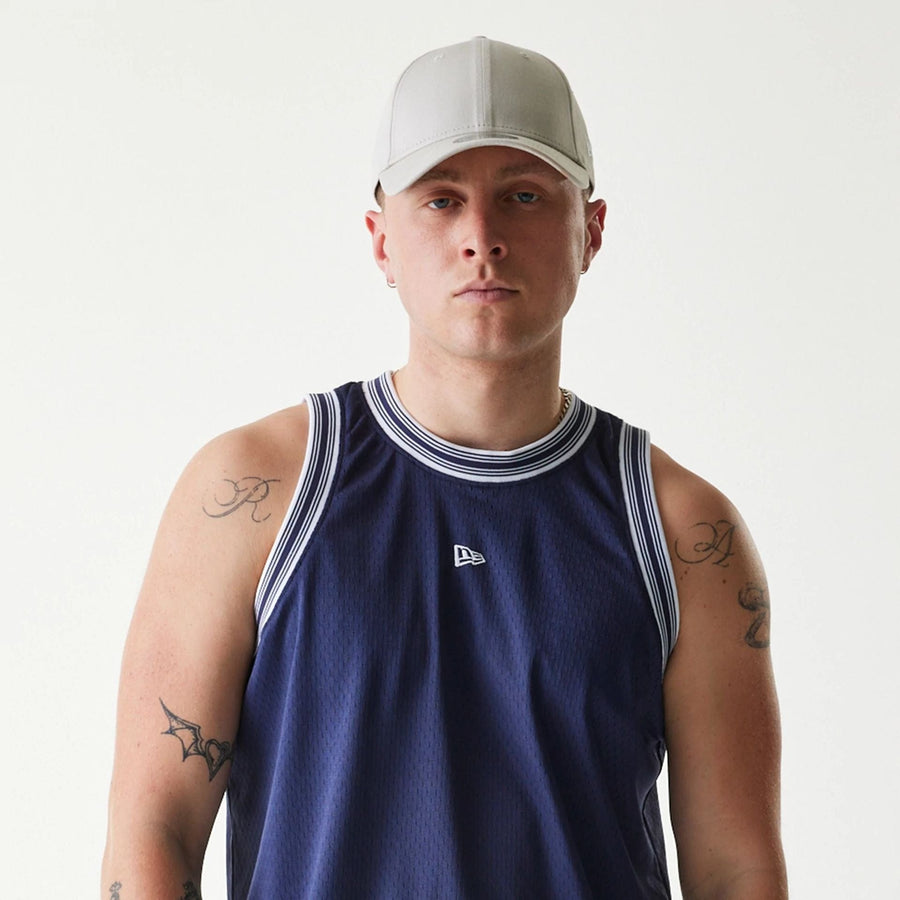 The Male model is wearing New Era Japan Mesh Navy Sleeveless T-Shirt 5
