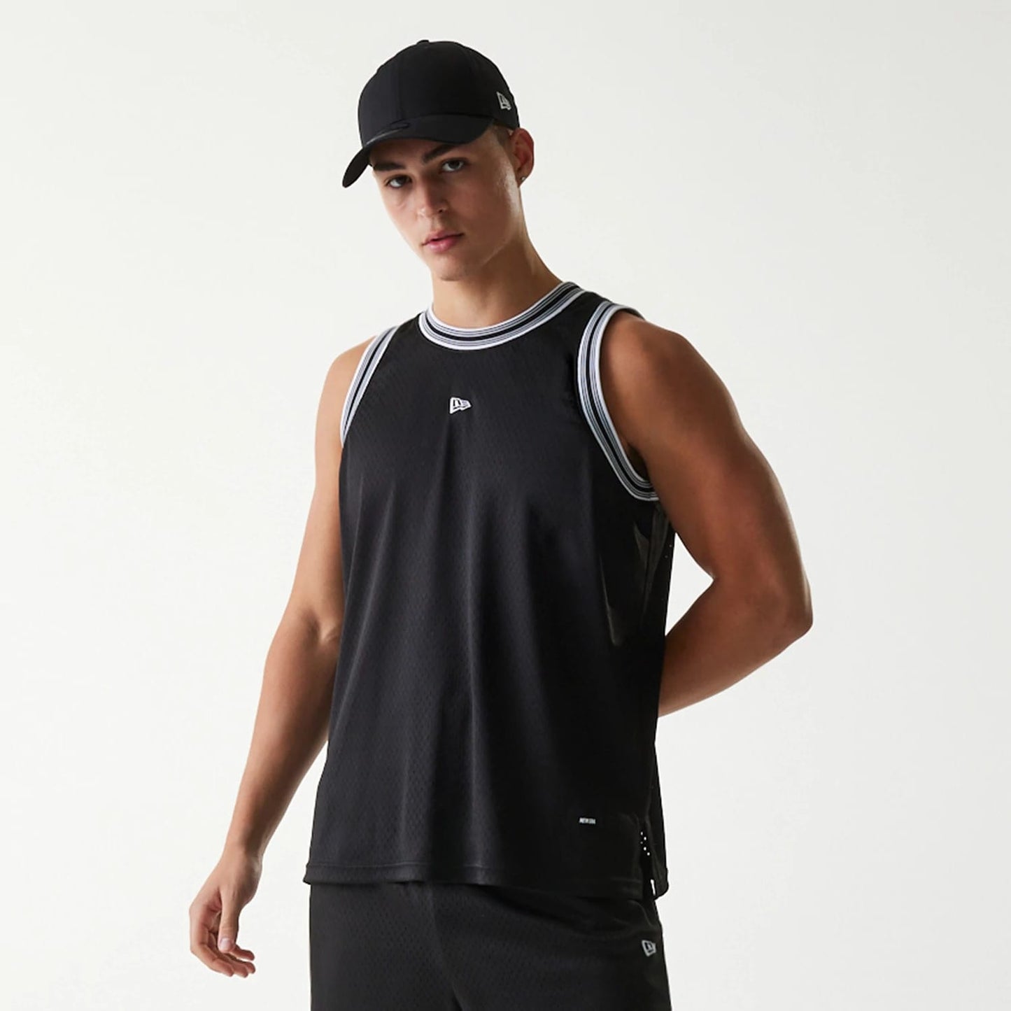 The Male model is wearing New Era Japan Mesh Black Sleeveless T-Shirt 5