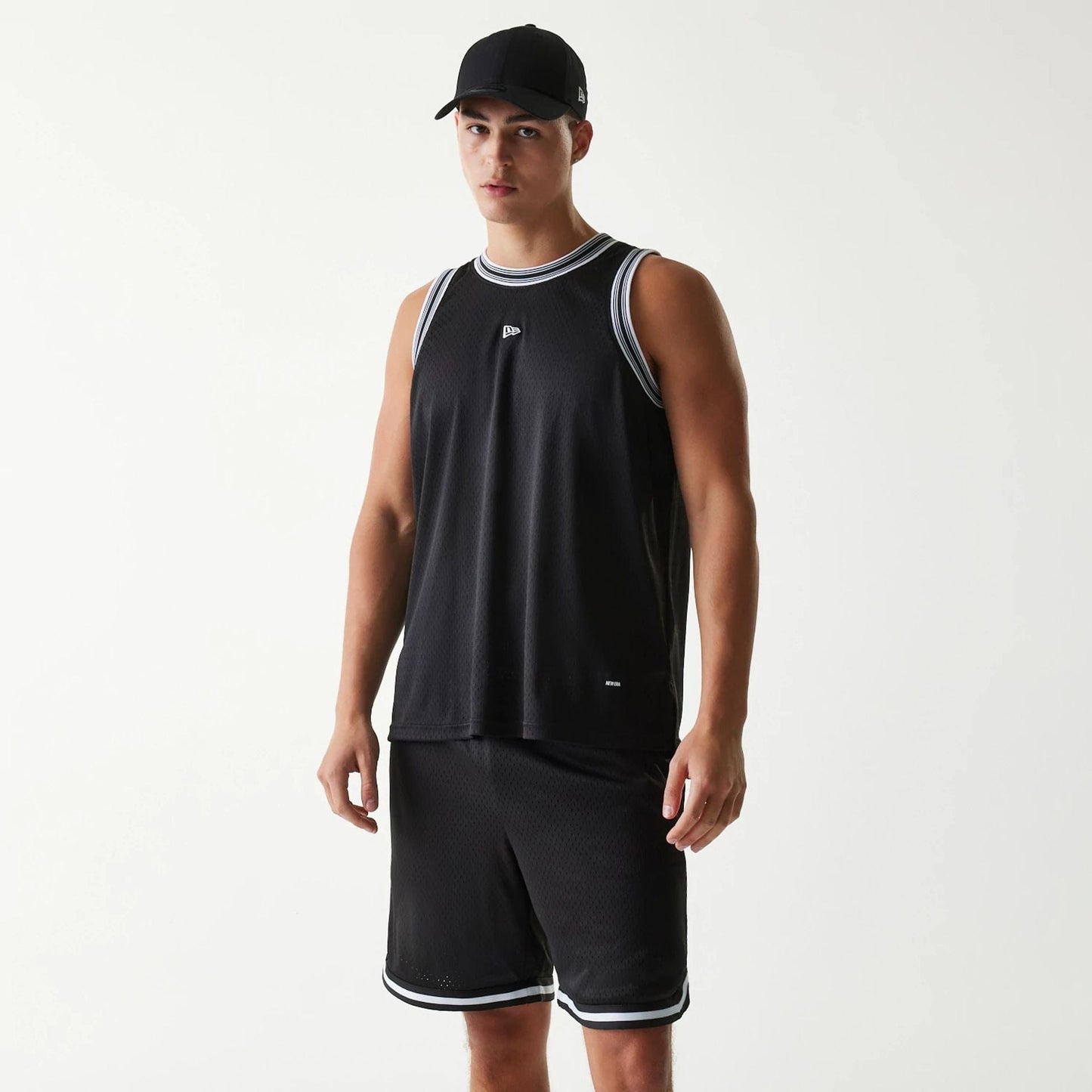 The Male model is wearing New Era Japan Mesh Black Sleeveless T-Shirt 1