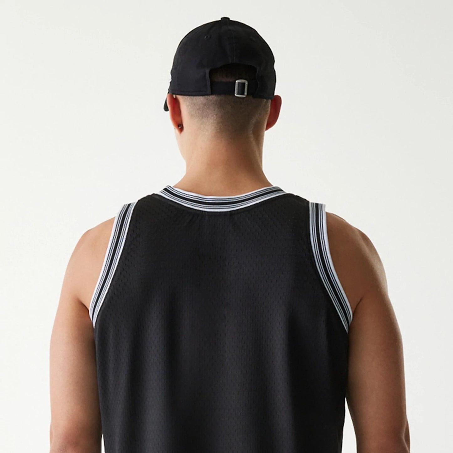 The Male model is wearing New Era Japan Mesh Black Sleeveless T-Shirt 6