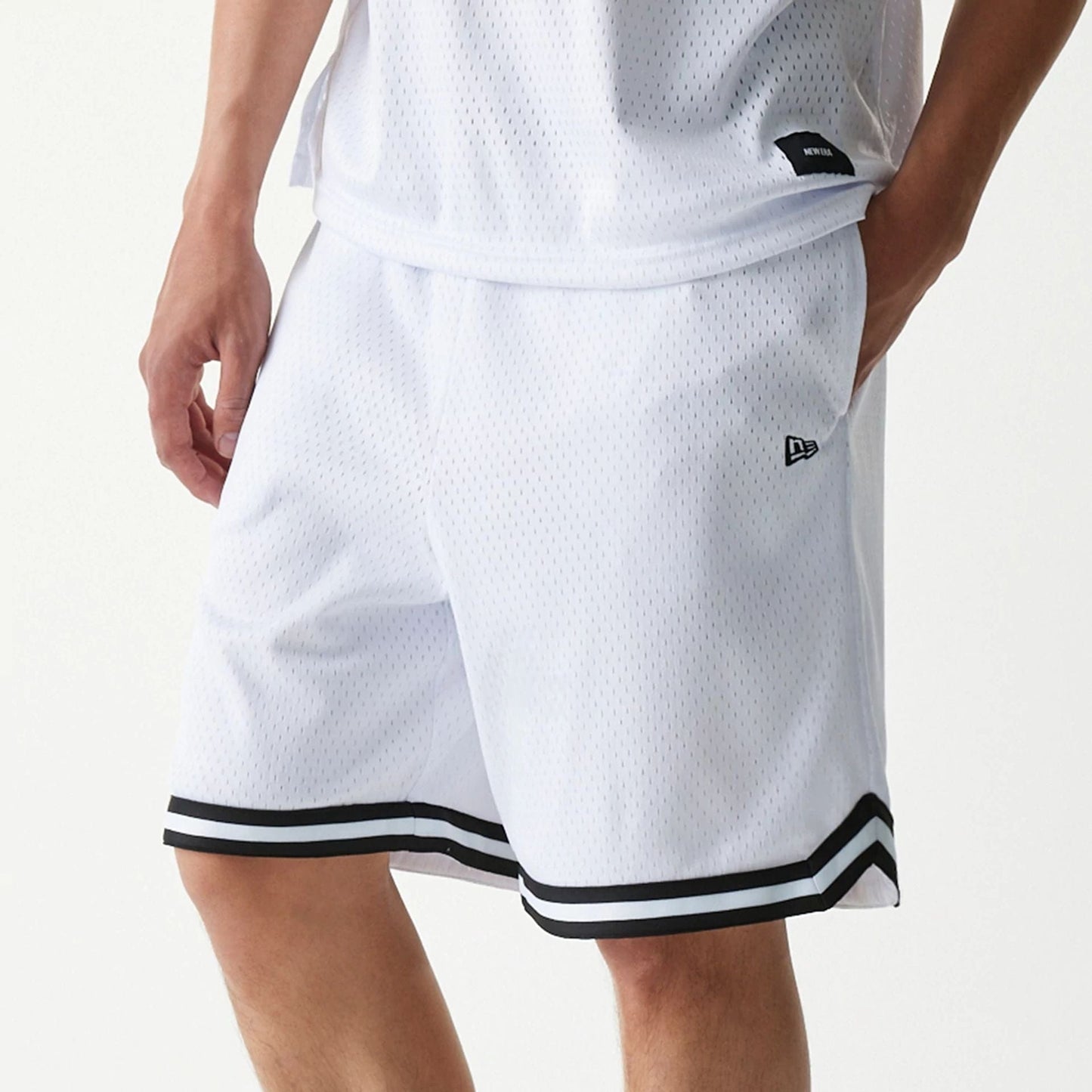 The Male model is wearing New Era Japan Mesh White Shorts 4