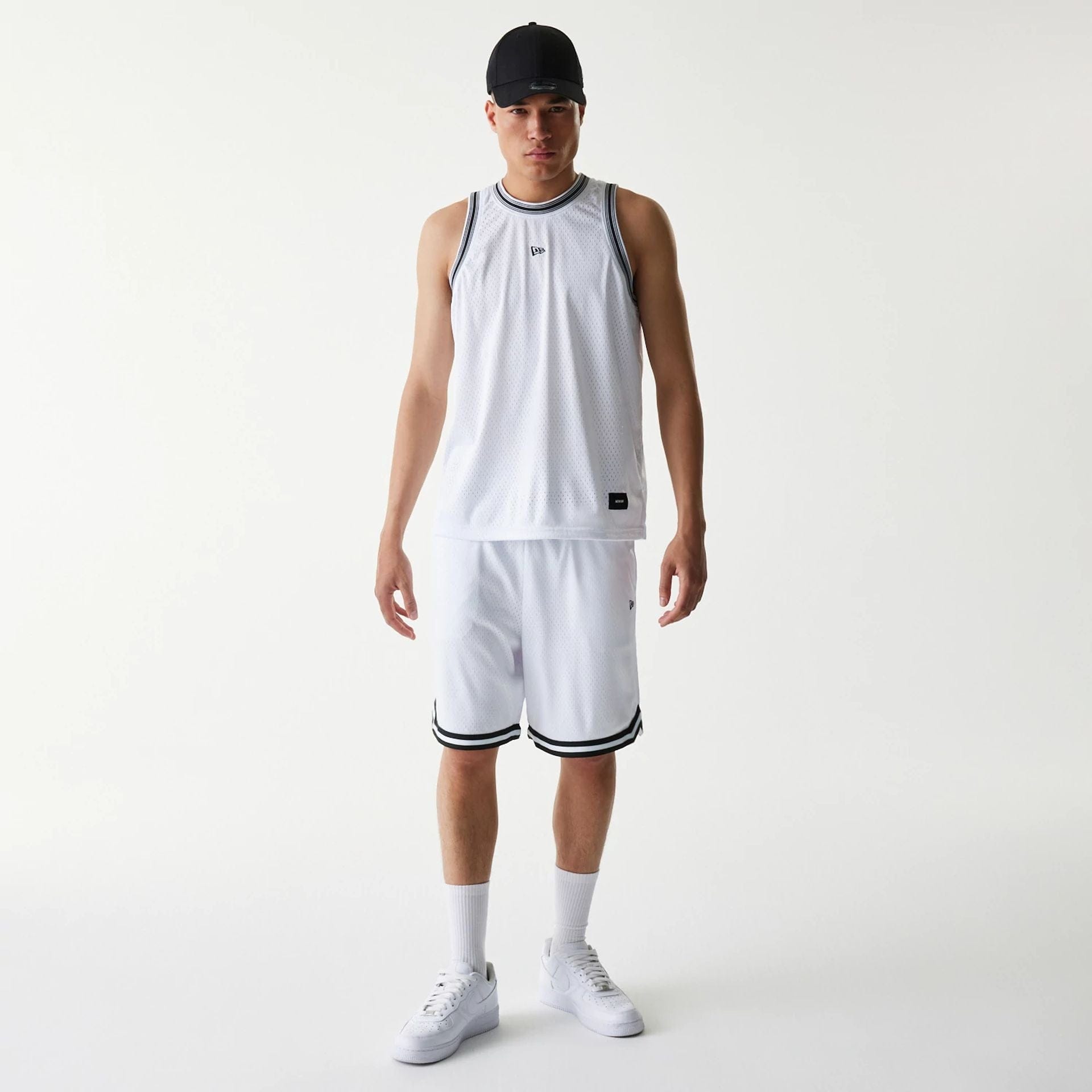 The Male model is wearing New Era Japan Mesh White Shorts 6