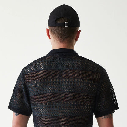 The Male model is wearing New Era Japan Mesh Black Polo T-Shirt 5
