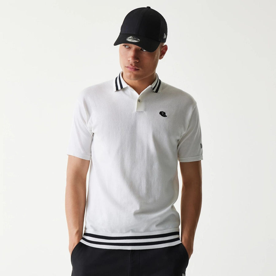 The Male model is wearing New Era Japan White Polo T-Shirt 1