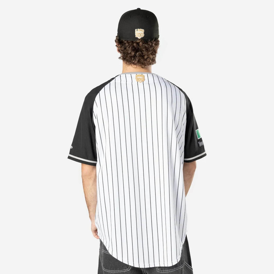 The Male model is wearing Oaxaca Guerreros Mexico LMB On Field White On-Field Jersey 2