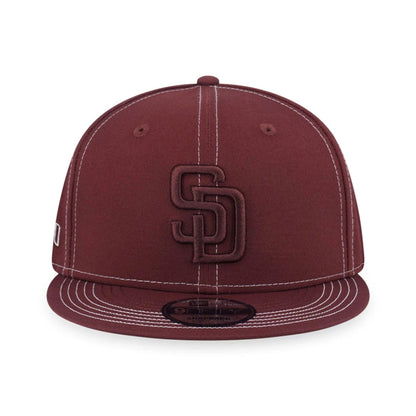 Pictured is this MLB Contrast Stitching San Diego Padres 9FIFTY Snapback cap in brown. 2