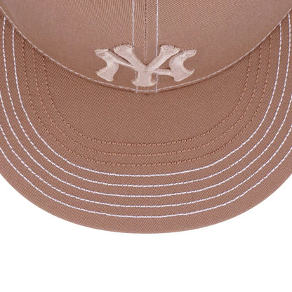 Pictured is this MLB Contrast Stitching New York Yankees 9FIFTY Snapback cap in beige. 4